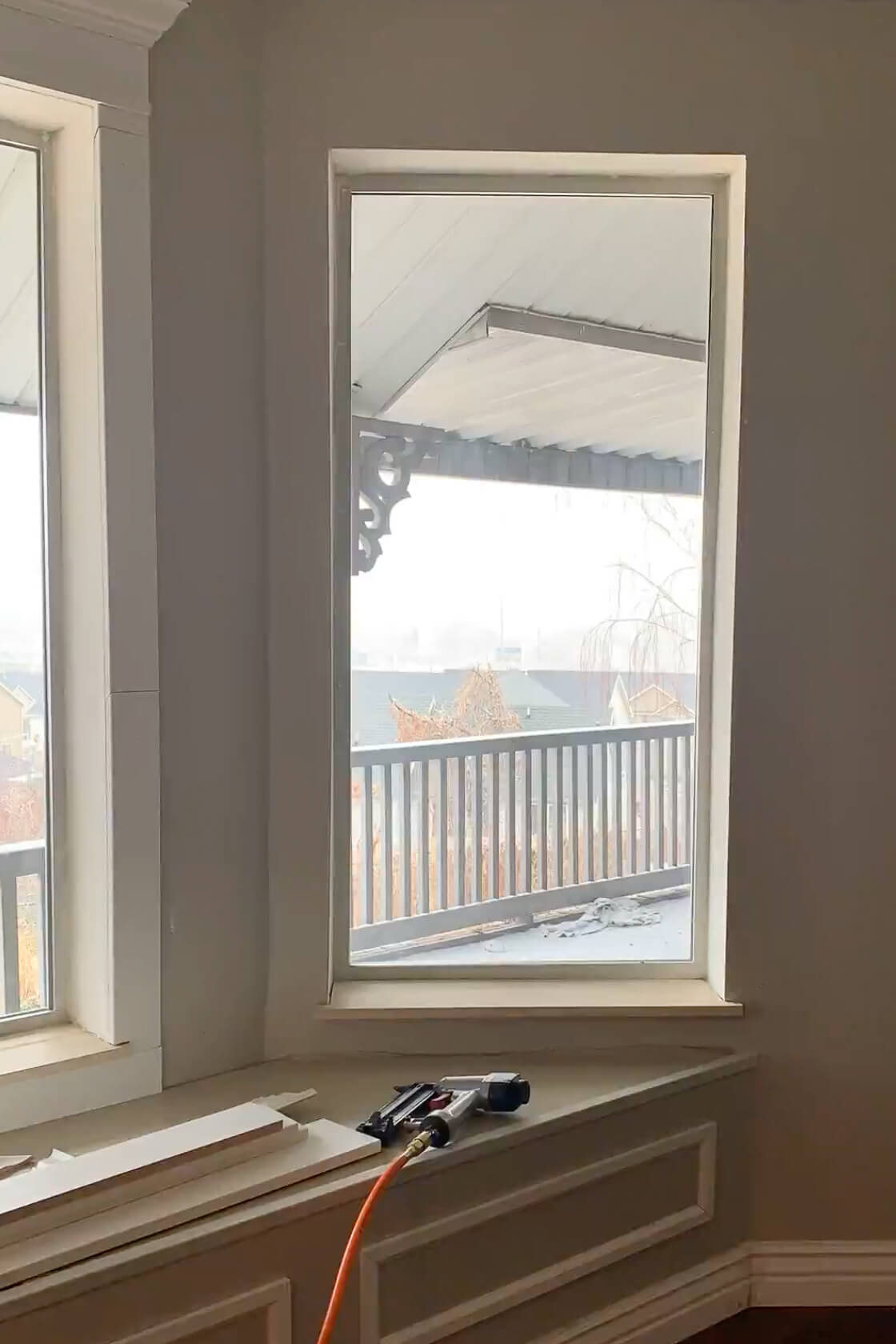 Adding a new window sill and window trim to a bay window.